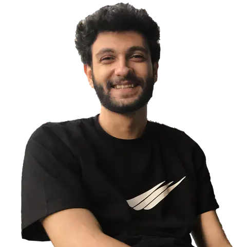 Portrait of Mohammad Salmani, smiling, in a black T-shirt.